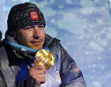 Gold medallist Miller poses during the medals ceremony for the men's super combined alpine skiing during the Vancouver 2010 Winter Olympics