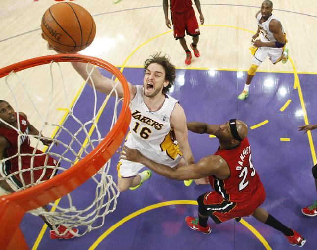 Los Angeles Lakers' Pau Gasol of Spain shoots the ball as Miami Heat's Erick Dampier defends during the second half of an NBA basketball game in Los Angeles