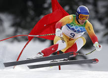 Canada's Erik Guay speeds down the course during the men's Alpine Skiing Downhill race of the Vancouver 2010 Winter Olympics in Whistler