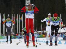 Norway's Northug celebrates as he crosses the finish line to win men's 50 km mass start classic cross-country final at Vancouver 2010 Winter Olympics in Whistler