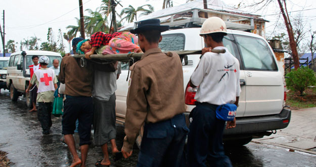 Red Cross volunteers transport a wounded person to hospital near Bogalay